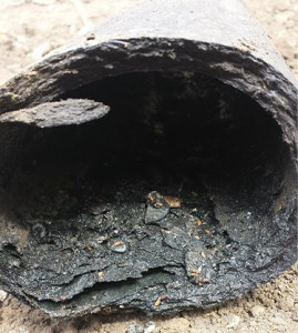 A damaged pitch fibre pipe.